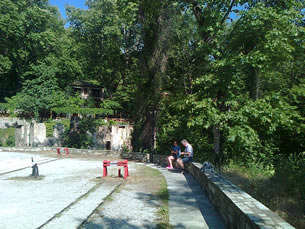 A steep walk from the plateia to the railway station, and a even steep return up to the village centre, Nicole and Raymond take a little rest moment